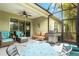 Covered patio features comfortable seating and stainless steel barbecue for outdoor cooking at 3922 Wildgrass Pl, Parrish, FL 34219