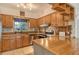 Close-up of the updated kitchen with stone countertops and stainless steel appliances at 418 Sarabay Rd, Osprey, FL 34229