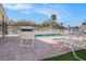 Community pool surrounded by lounge chairs on a sunny day at 4851 W Gandy Blvd # B1L8, Tampa, FL 33611