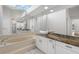 Bathroom with dual sink vanity, a bathtub, and lots of natural light at 6170 Misty Oaks Dr, Sarasota, FL 34243