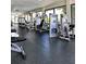 Well-equipped gym with modern exercise machines and large windows providing ample natural light at 6170 Misty Oaks Dr, Sarasota, FL 34243
