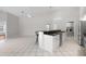 Bright kitchen boasts granite counters, white cabinets, and stainless steel appliances at 6170 Misty Oaks Dr, Sarasota, FL 34243