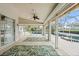Spacious lanai with tile flooring and ample room for entertaining offers easy access to the pool and outdoor areas at 6170 Misty Oaks Dr, Sarasota, FL 34243
