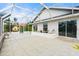 Screened-in lanai provides outdoor space and view to garden at 6170 Misty Oaks Dr, Sarasota, FL 34243