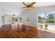 Open concept living room with hardwood floors and natural light at 6170 Misty Oaks Dr, Sarasota, FL 34243