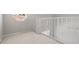 White railing overlooks the loft area at 6170 Misty Oaks Dr, Sarasota, FL 34243
