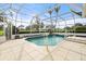 Inviting screened pool with well-maintained tile deck perfect for outdoor relaxation and entertainment at 6170 Misty Oaks Dr, Sarasota, FL 34243