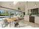 Bright sunroom features a dining area, casual seating and a beverage bar, perfect for entertaining at 6170 Misty Oaks Dr, Sarasota, FL 34243