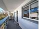 Condo balcony with seating area and views of trees at 6800 Placida Rd # 2017, Englewood, FL 34224
