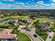 Aerial view of luxurious community, showcasing elegant homes, lush landscaping, and a winding street at 7315 Bianco Duck Ct, Sarasota, FL 34240