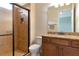 Modern bathroom with a tile shower, granite vanity, and updated fixtures at 7315 Bianco Duck Ct, Sarasota, FL 34240