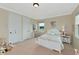 Bright bedroom with floral bedding and decor at 7315 Bianco Duck Ct, Sarasota, FL 34240