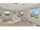 Bright bedroom with carpet floors, natural light, a comfortable bed, and ample space for furniture at 7315 Bianco Duck Ct, Sarasota, FL 34240