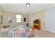 Colorful bedroom featuring bright decor, carpeted floors, and neutral paint at 7315 Bianco Duck Ct, Sarasota, FL 34240
