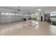 Spacious three car garage with epoxy flooring and two garage doors at 7315 Bianco Duck Ct, Sarasota, FL 34240
