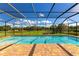 Enjoy the weather in this screened pool overlooking a lush green landscape at 7315 Bianco Duck Ct, Sarasota, FL 34240