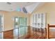 An upstairs bonus room is complete with hardwood floors, custom bookshelves, and sliding glass doors with water views at 16 Tidy Island Blvd # 16, Bradenton, FL 34210