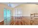 Upstairs bonus room is complete with hardwood floors, custom bookshelves, and sliding glass doors leading to a sun room at 16 Tidy Island Blvd # 16, Bradenton, FL 34210