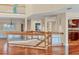 Bright entryway features hardwood floors, glass railings, and views into adjacent rooms at 16 Tidy Island Blvd # 16, Bradenton, FL 34210