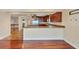 An open kitchen boasts granite counters, custom cabinets, and stainless appliances at 16 Tidy Island Blvd # 16, Bradenton, FL 34210