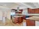 Gourmet kitchen with custom cabinetry, stainless steel appliances, and center island at 16 Tidy Island Blvd # 16, Bradenton, FL 34210