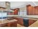 Spacious kitchen featuring custom wood cabinets, granite countertops, and modern appliances at 16 Tidy Island Blvd # 16, Bradenton, FL 34210