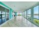 The bright lanai features tile floors, turquoise walls, sliding glass doors and windows, with great water views at 16 Tidy Island Blvd # 16, Bradenton, FL 34210