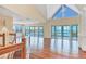 Bright living room features hardwood floors, large windows with water views, and access to the lanai at 16 Tidy Island Blvd # 16, Bradenton, FL 34210