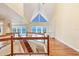 Bright living room with hardwood floors, large windows with views of the water, and built-in shelving at 16 Tidy Island Blvd # 16, Bradenton, FL 34210