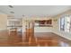 Spacious living room featuring hardwood floors, lots of natural light, and access to additional living spaces at 16 Tidy Island Blvd # 16, Bradenton, FL 34210