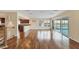 A spacious living area with hardwood floors, large windows, and bar-style seating at 16 Tidy Island Blvd # 16, Bradenton, FL 34210