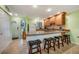 Spacious kitchen featuring a breakfast bar, modern appliances, and ample cabinet storage space at 1801 Gulf N Dr # 175, Bradenton Beach, FL 34217