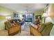 Comfortable living room featuring cozy furniture and sliding glass doors leading to the outdoors at 1801 Gulf N Dr # 175, Bradenton Beach, FL 34217