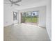 Vacant bedroom with natural light, neutral walls, and outdoor views through sliding glass door at 3810 Gulf Of Mexico Dr # F105, Longboat Key, FL 34228