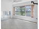 This living room has large windows providing natural light and outdoor views at 3810 Gulf Of Mexico Dr # F105, Longboat Key, FL 34228