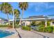 Community pool area featuring a covered gazebo and comfortable seating at 3810 Gulf Of Mexico Dr # F105, Longboat Key, FL 34228