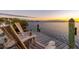 Scenic view from the private dock at sunset, featuring comfortable chairs at 3930 Red Rock Way, Sarasota, FL 34231