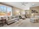 Cozy living room with a sofa, seating, and a window offering an outside view at 3930 Red Rock Way, Sarasota, FL 34231