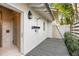 Outdoor shower space featuring a stone tiled shower stall and gray decking at 3930 Red Rock Way, Sarasota, FL 34231