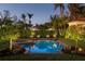 Relaxing outdoor pool and lounge area surrounded by lush tropical landscaping with inviting umbrellas for shade at 3930 Red Rock Way, Sarasota, FL 34231