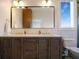 Elegant bathroom with a double sink vanity, modern mirror, and stylish fixtures at 630 Companion Way, Longboat Key, FL 34228