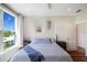 Bedroom featuring white bedding, natural light, and a view of the neighborhood at 630 Companion Way, Longboat Key, FL 34228