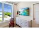 A room with a view: window with a view, dresser and TV at 630 Companion Way, Longboat Key, FL 34228