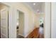 Hallway showcasing hardwood floors and entryways to bedrooms at 630 Companion Way, Longboat Key, FL 34228