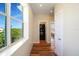 Convenient laundry area with stacked washer and dryer, next to bedroom at 630 Companion Way, Longboat Key, FL 34228