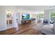 Open-concept living room with hardwood floors, modern decor, and large windows with great views at 630 Companion Way, Longboat Key, FL 34228