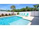 Enjoy a refreshing dip in the sparkling pool, surrounded by lush tropical landscaping and a privacy fence at 630 Companion Way, Longboat Key, FL 34228