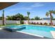 Relax in your private pool and spa with stylish tile surround amidst lush landscaping for ultimate relaxation at 630 Companion Way, Longboat Key, FL 34228