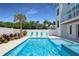 Beautiful backyard pool and jacuzzi area, complete with new landscaping and comfortable lounge chairs at 630 Companion Way, Longboat Key, FL 34228