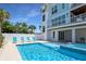 Stunning backyard pool area, complete with lounge chairs and a seamlessly integrated jacuzzi at 630 Companion Way, Longboat Key, FL 34228
